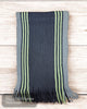 This luxurious scarf showcases a refined charcoal base, beautifully enhanced by contrasting stripes in vibrant green and soft grey.