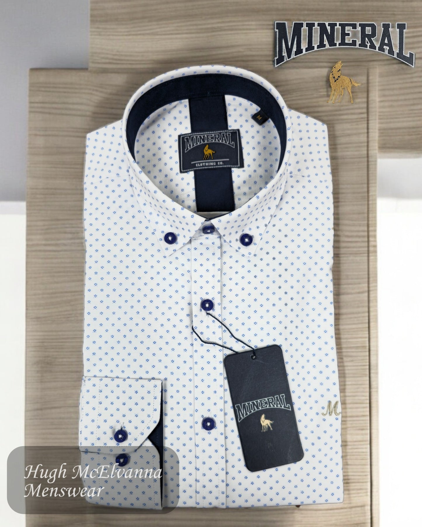 This white shirt with a blue micro-pattern design showcases a modern yet timeless aesthetic