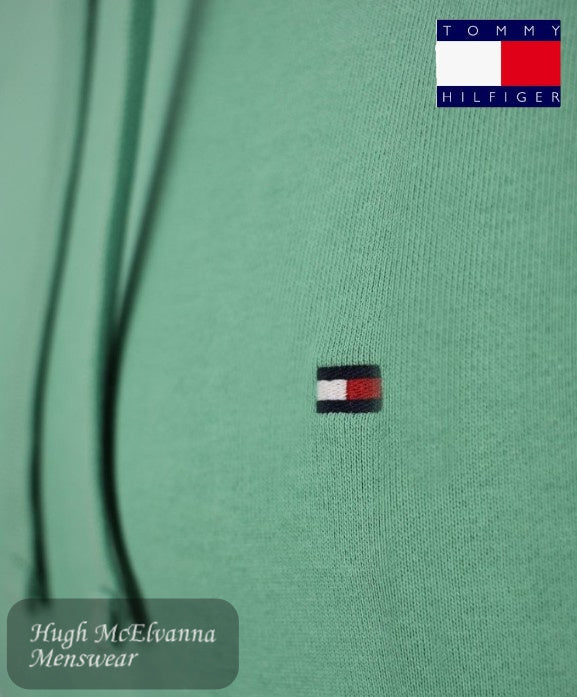 Iconic Branding – Features Tommy Hilfiger flag embroidery on the chest and signature branding details.